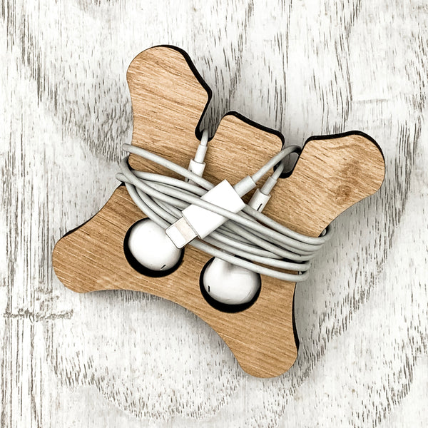 wooden earphone wrappers beige in color with wrapped white earphones