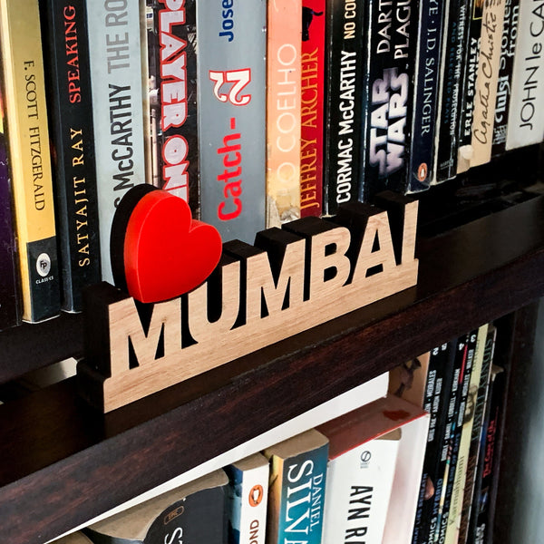 Love Mumbai signage on bookshelf