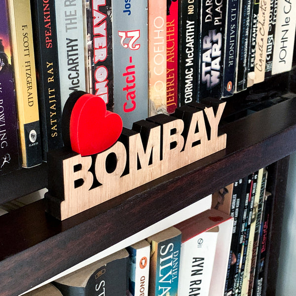 Love Bombay signage on bookshelf