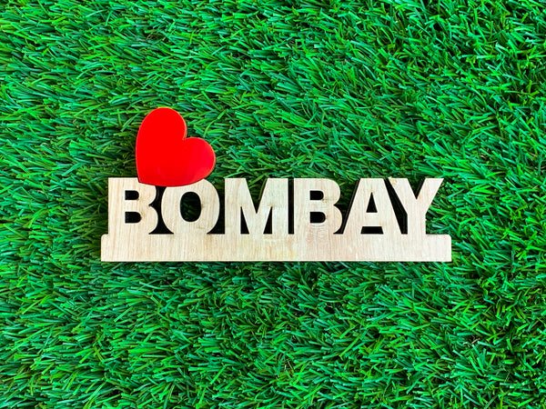 Love Bombay signage on green grass