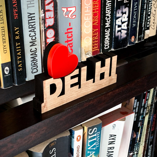 Love Delhi signage on a bookshelf